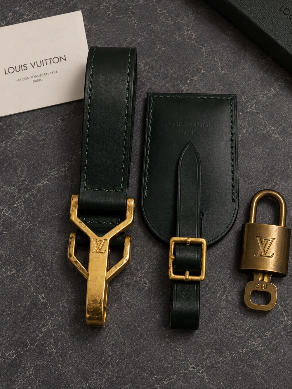 Louis Vuitton Three Piece Set - Taiga Luggage Fastener Strap, Tag, & Padlock